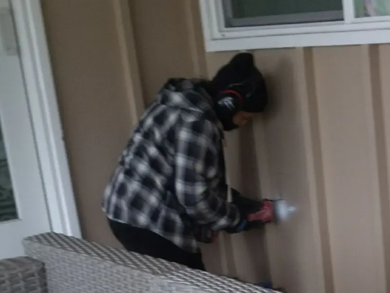 Professional electrician installing an exterior outlet in Roselle
